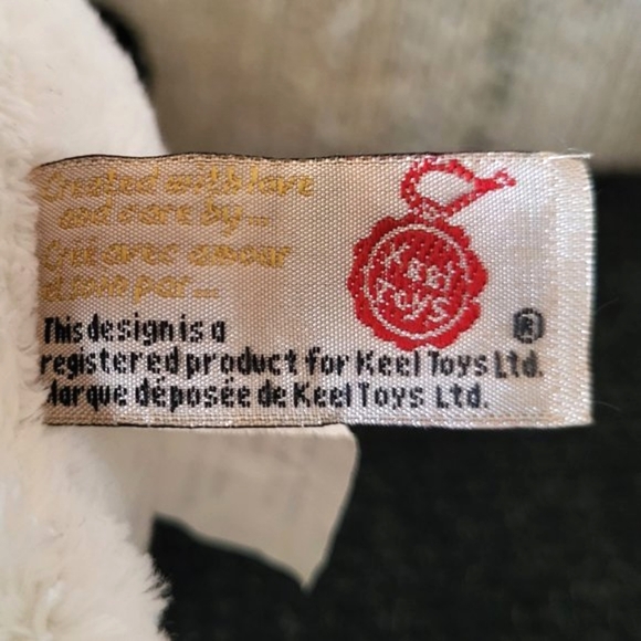 KEEL TOYS Black & White 9" Cow Plush with Blue Eyes & Pocket Stuffed Animal Toy - Picture 8 of 9